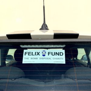 Felix Fund car sticker in the rear window of a car